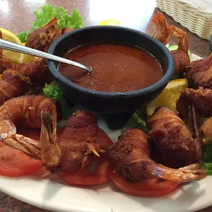 Shrimp covered in cheese wrapped in bacon. It's a must try!!