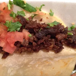 Asada taco with old dried burnt out meat