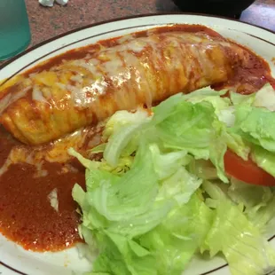 Mini burrito especial with carnitas. The only reason why there is so much salad on it, is because the bf added his to my plate.