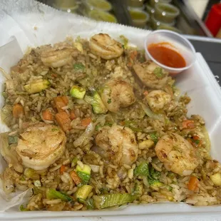 shrimp fried rice in a styrofoam container