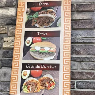 a menu on a stone wall