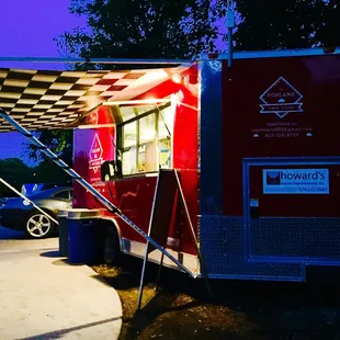 a food truck parked in a parking lot