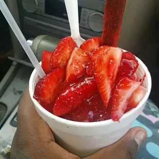 Natural snow cone with strawberry and lucas candy!! The best in town