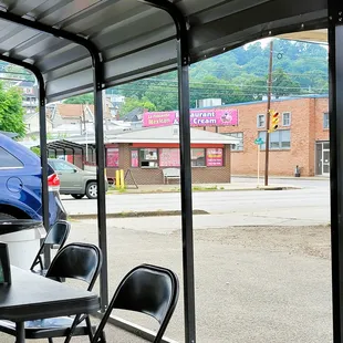 a view of a street from a restaurant