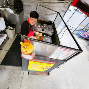 a man preparing food in a kitchen