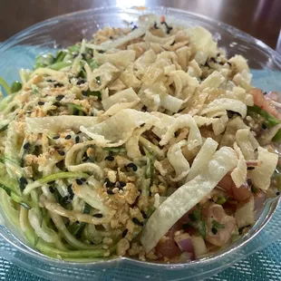 a salad in a plastic bowl