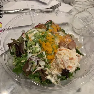 Poke bowl. Less than half the bowl is filled.