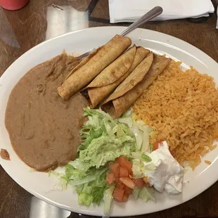 Flautas, rice, and beans.