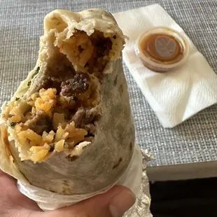 Asada regular burrito with one red salsa. Salsa is good, I wish I had at least one more.