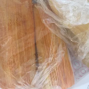 Half a dozen of pork and chicken tamales. They let you split half and half for the dozen order.