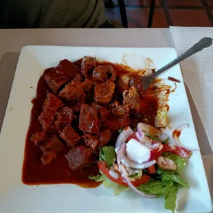 Chile colorado - tender beef, rich flavor and lots of beef.