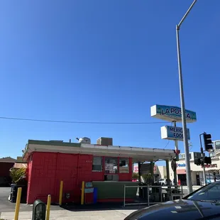 a car parked in front of a gas station