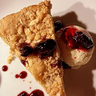 a piece of pie and a scoop of ice cream