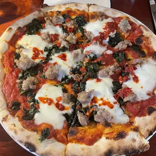 Sausage pizza with a bit of kale ( it disappears and is not overpowering)
