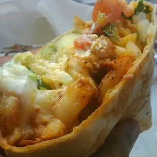 Close up.... Shrimp burrito no lettuce w/ tomato, avocado, rice, cilantro and onion. Wooo!