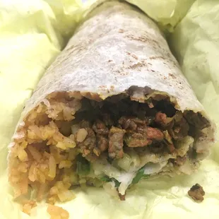 Carne Assad Burrito w/ beans, rice and all the fixings. Really tasty and great for the price.