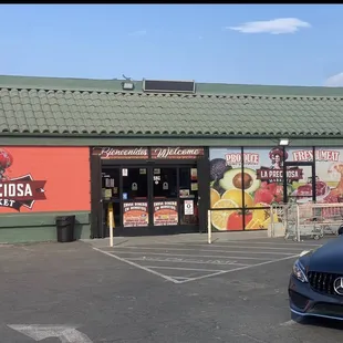 a car parked in front of the store