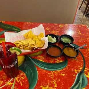 a plate of chips and salsa