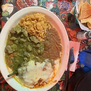 Pork in green salsa w/beans-rice and chile relleno on the side exquisite delicious