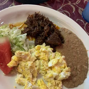 Barbacoa Plate with scrambled eggs, tortillas on side