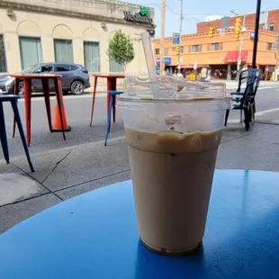 a coffee cup on a blue table