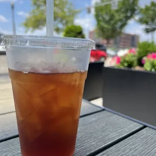 a plastic cup of iced tea