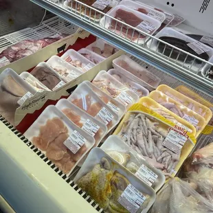 a display of meat in a deli
