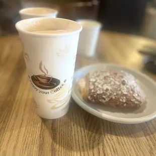 a cup of coffee and a pastry