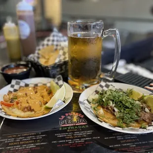 Tall draft Modelo. Chips and salsa. A taco el gobernador with creamy chipotle sauce and a carnitas taco.
