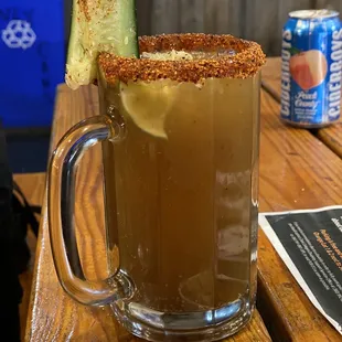 a drink with a garnish on the rim