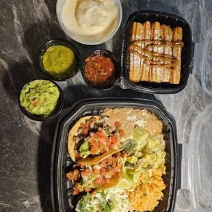 Shrimp, al pastor, and carne asada tacos with churros and vanilla ice cream