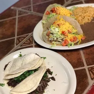 Puffy taco plate alongside barbacoa tacos on corn tortillas