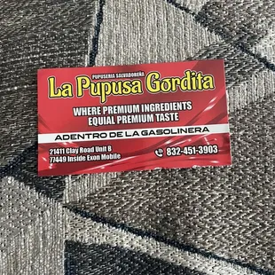 a business card on a carpet