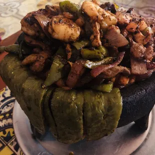 I have no idea what this is called. But, it has shrimp, fish, chicken, peppers and cactus. The flavor is deep and delicious!