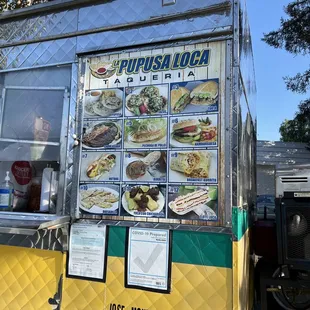 a food truck with menus