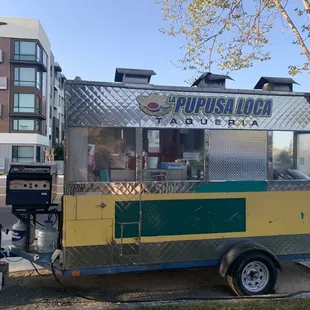 a food truck parked on the side of the road