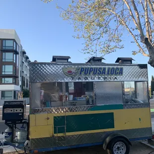 a food truck parked on the side of the road