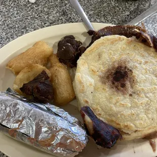 Combination A (yucca, chicharon, tamal and 2 pupusas