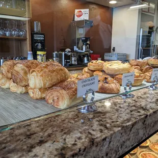Croissants galore and quiches in case underneath
