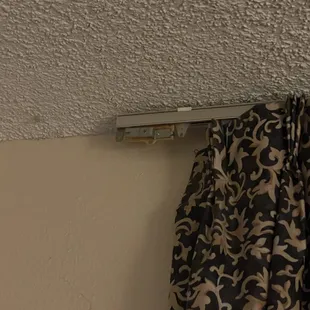 Cobwebs and broken drapes.