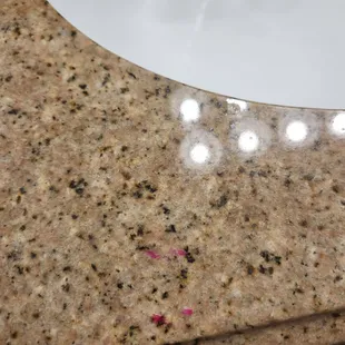 stained with nail polish and not attached to the wall.