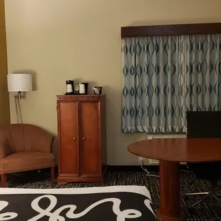 Desk + microwave and frig in cabinet