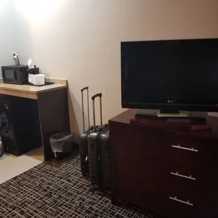 TV, dresser, microwave, fridge