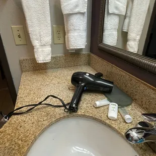 Electrical outlet is illegal. Needs to be a GFCI.