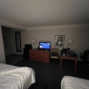 Rest of room. Smaller dated tv, dirty remote