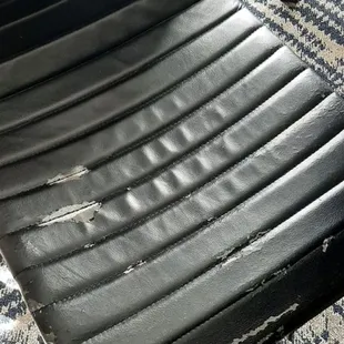 An old rusty torn chair in my room