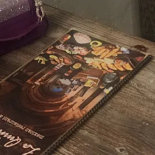 A cockroach hanging out by the menu after it fell from the cieling