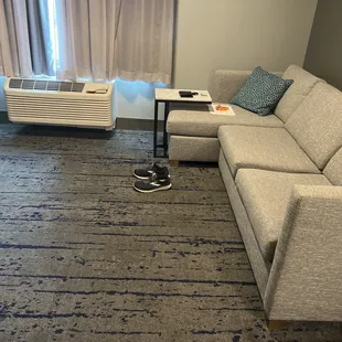 TV area. Nothing to put your feet up on, no coffee table, nothing at all!