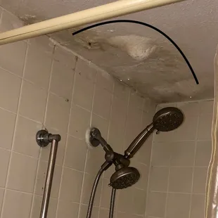 This was a scary shower stall, with all sorts of plaster and sheetrock built up upon itself, I guess to stop a bad leak.
