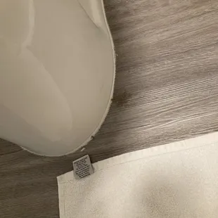 Unknown brown ick at the base of the toilet